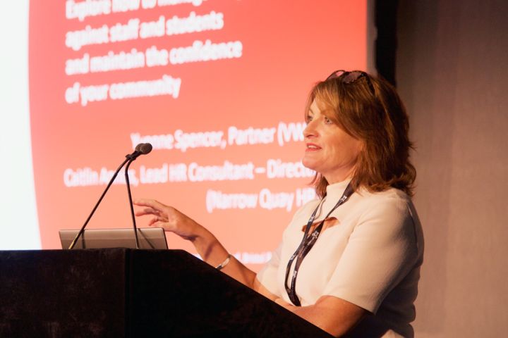 Optimus Education conference expert speaking at a conference