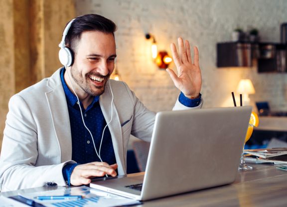 Man taking online training with laptop